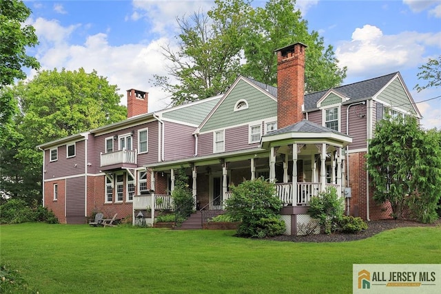 241 E Chestnut Ave, Metuchen, NJ 08840 - rear view of house featuring a chimney, a yard, a porch, and brick siding