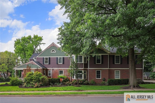 241 E Chestnut Ave, Metuchen, NJ 08840 - view of front of property featuring a front yard and brick siding