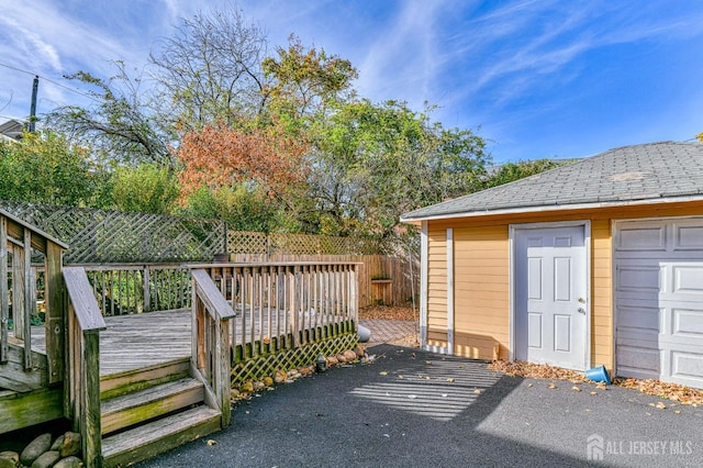 exterior space featuring an outdoor structure and a garage