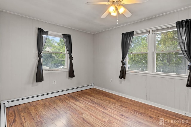 15 Cutter Ave, Fords, NJ 08863 - spare room featuring wood finished floors, baseboard heating, ceiling fan, crown molding, and baseboards