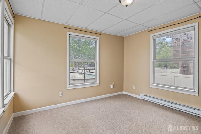 15 Cutter Ave, Fords, NJ 08863 - spare room featuring a baseboard radiator, a drop ceiling, plenty of natural light, carpet floors, and baseboards