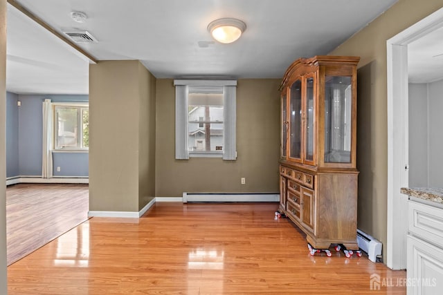 15 Cutter Ave, Fords, NJ 08863 - unfurnished room featuring baseboard heating, light wood-type flooring, and baseboards