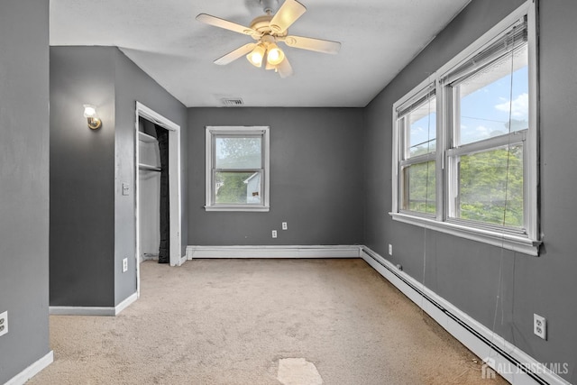 15 Cutter Ave, Fords, NJ 08863 - unfurnished bedroom featuring baseboard heating, carpet, baseboards, a closet, and a ceiling fan