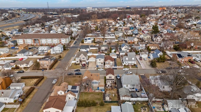 birds eye view of property with a residential view