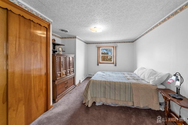 carpeted bedroom featuring a baseboard heating unit, a textured ceiling, visible vents, and crown molding