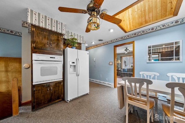 kitchen with white appliances, carpet, baseboard heating, and ceiling fan