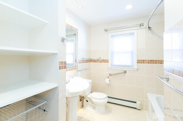 2624 Tremley Point Rd, Linden, NJ 07036 - bathroom featuring a baseboard heating unit, tile walls, toilet, tile patterned flooring, and a bathtub