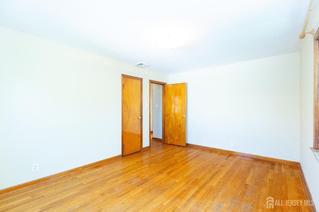 2624 Tremley Point Rd, Linden, NJ 07036 - spare room with light wood-style flooring and baseboards