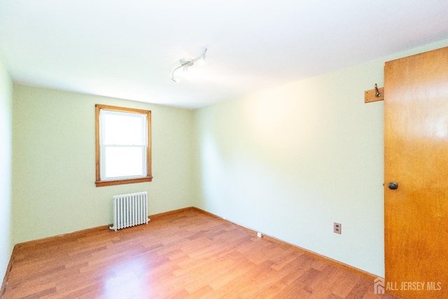 2624 Tremley Point Rd, Linden, NJ 07036 - unfurnished room with radiator and light wood finished floors