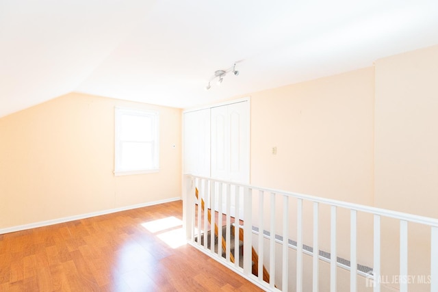2624 Tremley Point Rd, Linden, NJ 07036 - bonus room with wood finished floors, lofted ceiling, and baseboards