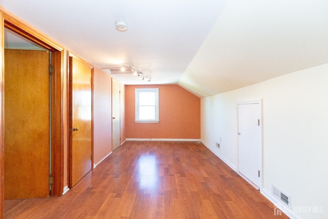 2624 Tremley Point Rd, Linden, NJ 07036 - bonus room with wood finished floors, vaulted ceiling, and baseboards