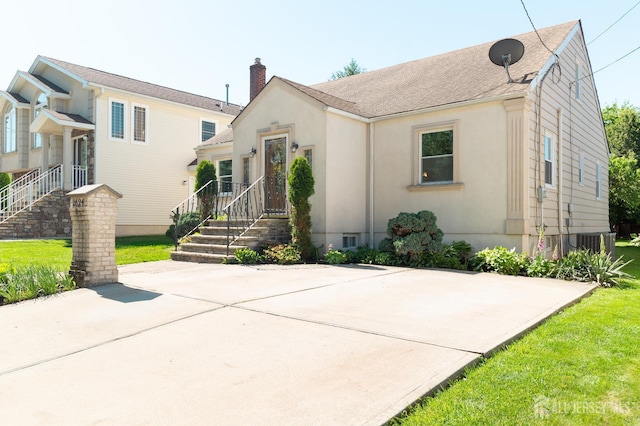 2624 Tremley Point Rd, Linden, NJ 07036 - view of front of home featuring a chimney and central AC unit