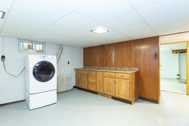 2624 Tremley Point Rd, Linden, NJ 07036 - laundry area featuring radiator, cabinet space, wood walls, and washer / dryer
