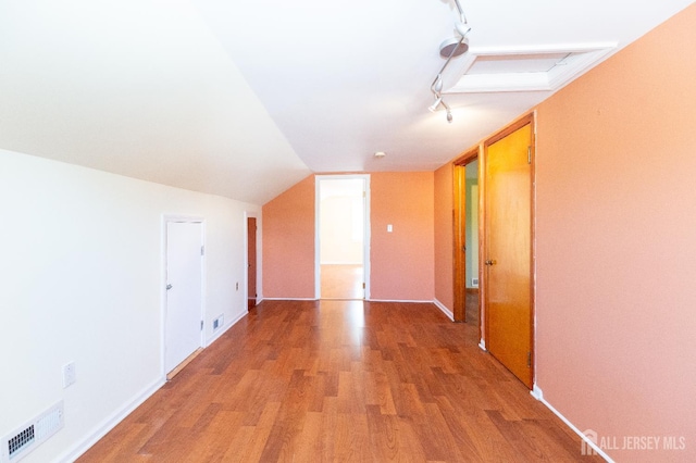 2624 Tremley Point Rd, Linden, NJ 07036 - bonus room with light wood-type flooring, baseboards, and lofted ceiling