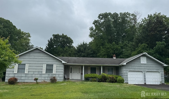 26 Thrush Dr, East Brunswick, NJ 08816 - ranch-style house featuring a garage, a front yard, asphalt driveway, and a chimney