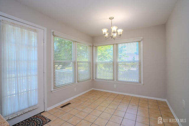55 Cambridge Way, West Windsor, NJ 08550 - unfurnished dining area featuring plenty of natural light, a chandelier, and baseboards