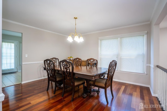 55 Cambridge Way, West Windsor, NJ 08550 - dining area featuring dark wood-style floors, ornamental molding, a chandelier, and baseboards