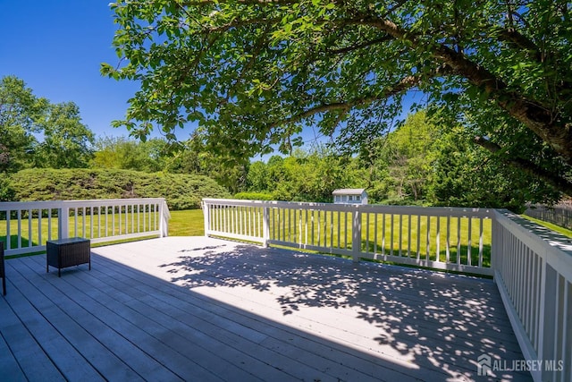 55 Cambridge Way, West Windsor, NJ 08550 - wooden deck featuring a lawn