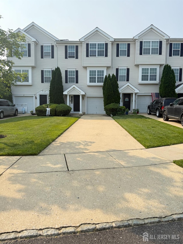 31 Highgrove Ct, West Deptford, NJ 08086 - view of front of property with an attached garage, driveway, and a front lawn