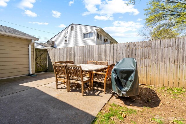 69 Claridge Pl, Colonia, NJ 07067 - fenced backyard featuring a patio area, outdoor dining area, a grill, and a gate