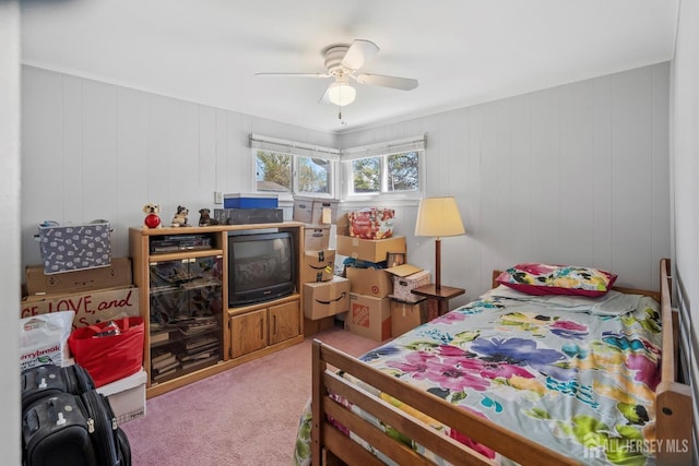 bedroom featuring light colored carpet and ceiling fan