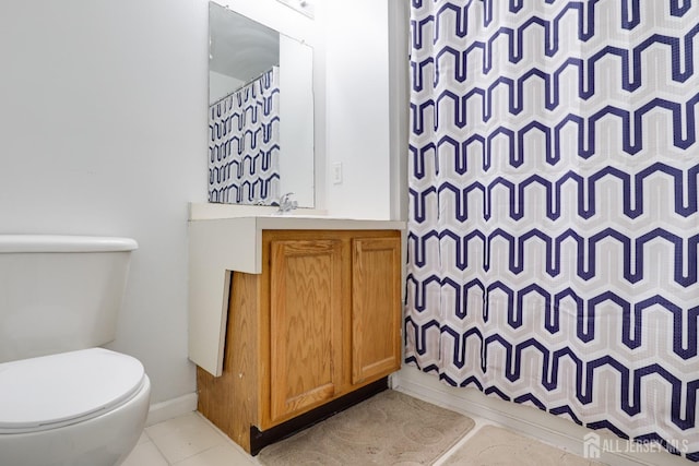 128 Remsen Ave Unit A, New Brunswick, NJ 08901 - full bath featuring toilet, vanity, a shower with shower curtain, baseboards, and tile patterned floors