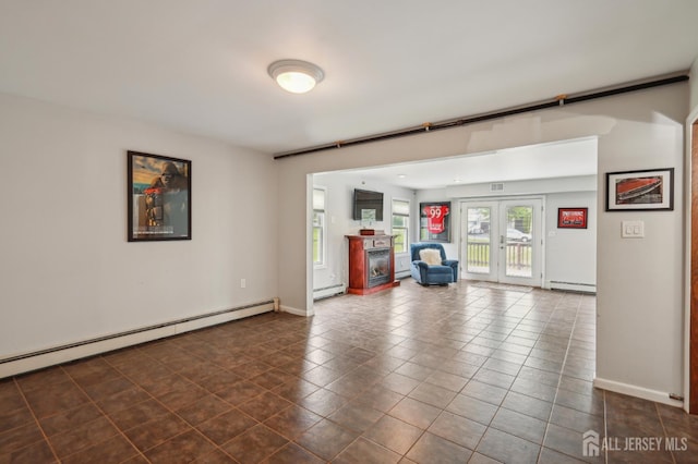 23 Little Brook Ln, Monroe, NJ 08831 - unfurnished living room with a baseboard heating unit, a baseboard radiator, a fireplace, dark tile patterned flooring, and baseboards
