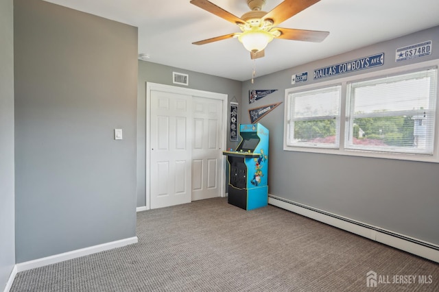 23 Little Brook Ln, Monroe, NJ 08831 - unfurnished bedroom with a baseboard radiator, carpet, a closet, baseboards, and ceiling fan