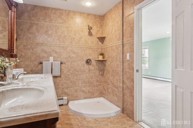 23 Little Brook Ln, Monroe, NJ 08831 - bathroom with baseboard heating, a tile shower, double vanity, tile walls, and tile patterned floors
