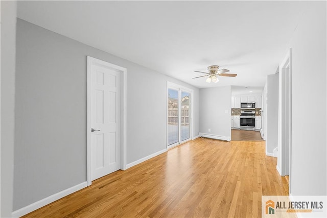unfurnished living room featuring baseboards, light wood-type flooring, and a ceiling fan