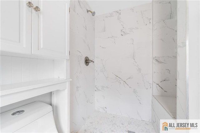 full bathroom featuring a marble finish shower