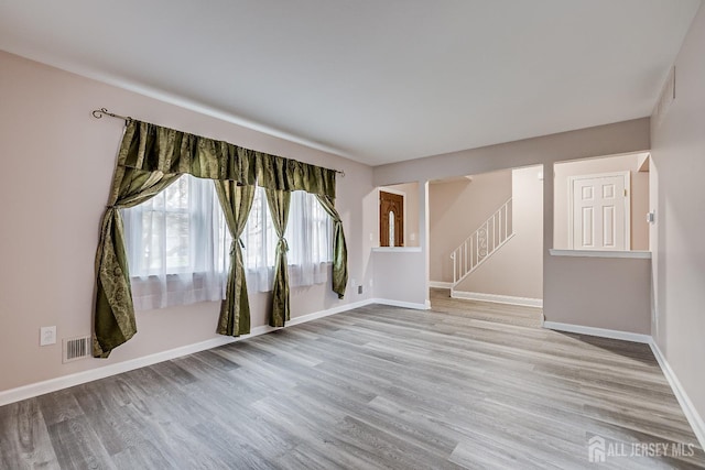 86 Bunker Hill Rd, Lawrence, NJ 08648 - unfurnished room featuring wood finished floors and stairway