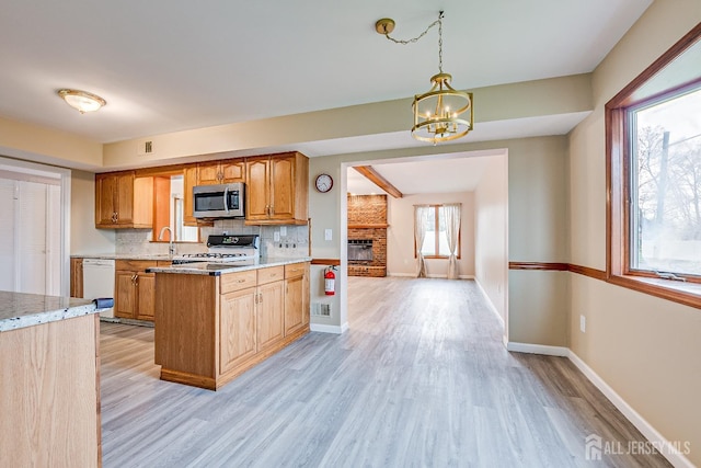 86 Bunker Hill Rd, Lawrence, NJ 08648 - kitchen with stainless steel microwave, stove, a chandelier, dishwasher, and light wood-type flooring