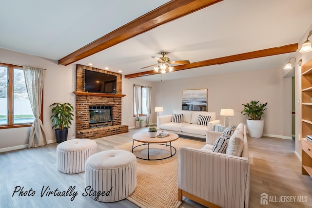 86 Bunker Hill Rd, Lawrence, NJ 08648 - living area featuring beam ceiling, light wood-style flooring, a brick fireplace, and ceiling fan