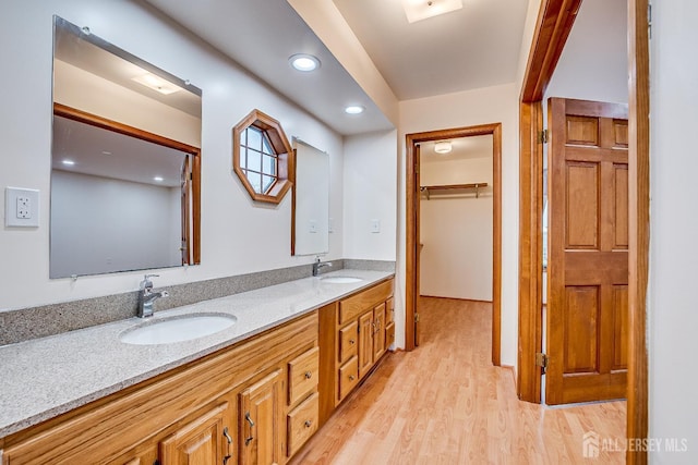 86 Bunker Hill Rd, Lawrence, NJ 08648 - full bathroom with double vanity, wood finished floors, recessed lighting, and a walk in closet