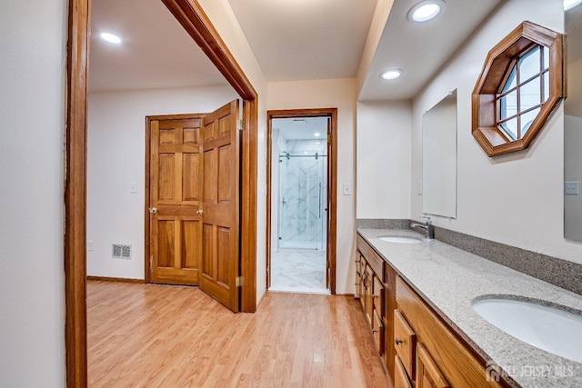 86 Bunker Hill Rd, Lawrence, NJ 08648 - bathroom with a shower stall, double vanity, wood finished floors, and recessed lighting