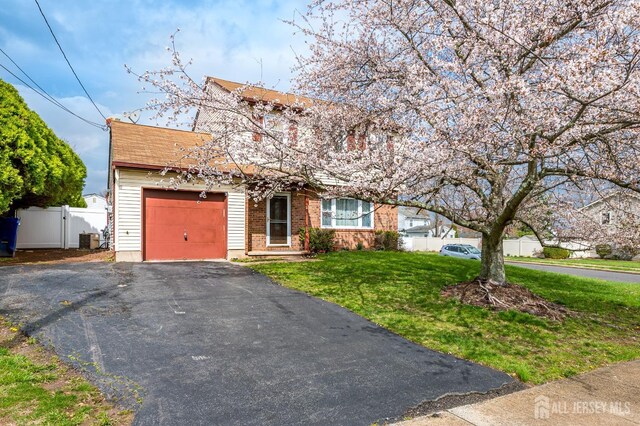 86 Bunker Hill Rd, Lawrence, NJ 08648 - view of front facade featuring a garage, driveway, and brick siding