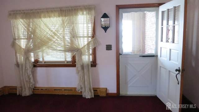 entryway featuring a baseboard heating unit