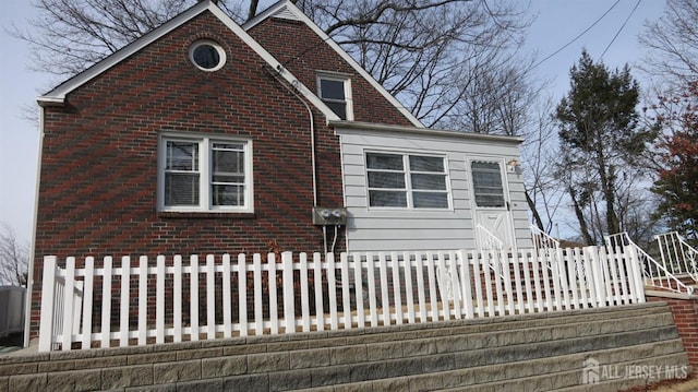 view of front of property featuring brick siding