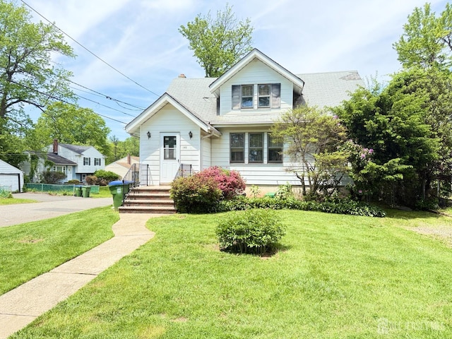 bungalow-style home featuring a front lawn