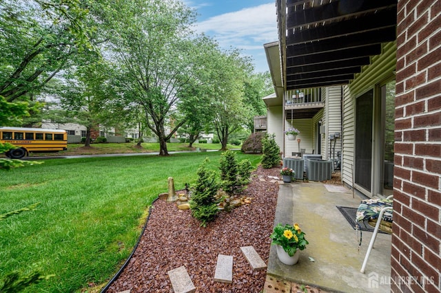101 Mandon Ct Unit 4, South Brunswick, NJ 08540 - view of green lawn with cooling unit and a patio