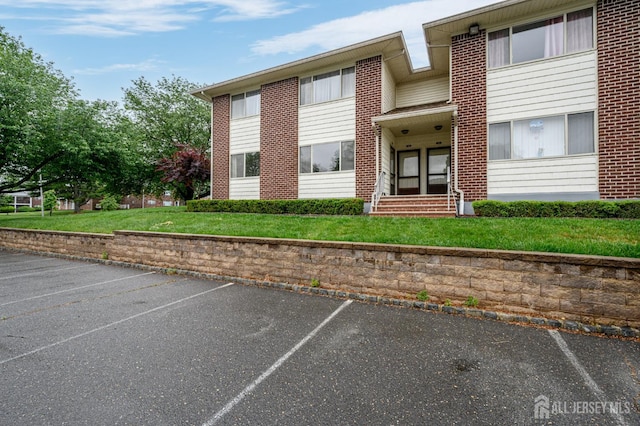 101 Mandon Ct Unit 4, South Brunswick, NJ 08540 - view of property featuring uncovered parking