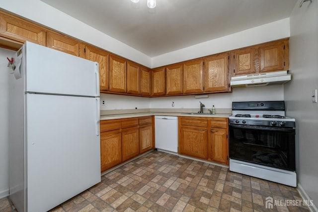101 Mandon Ct Unit 4, South Brunswick, NJ 08540 - kitchen featuring white appliances, under cabinet range hood, a sink, light countertops, and brick patterned floors