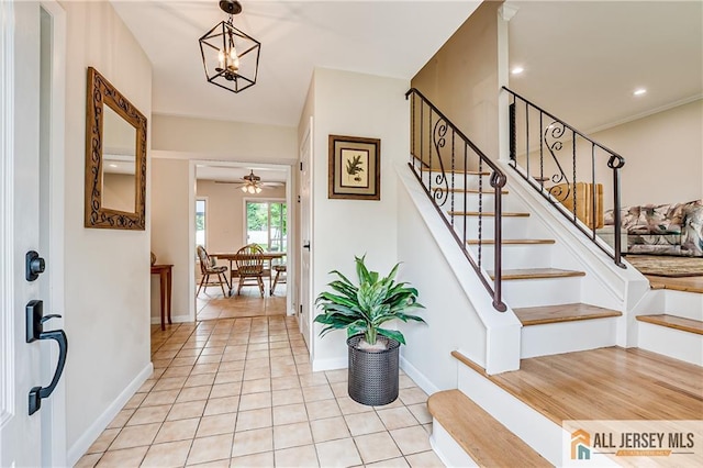 13 Steven Rd, South Brunswick, NJ 08824 - foyer with stairway, a chandelier, light tile patterned floors, a ceiling fan, and baseboards