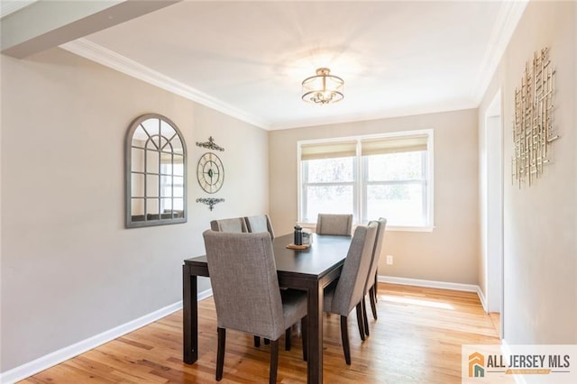 1516 N Indian Pl, North Brunswick, NJ 08902 - dining space with crown molding, light wood finished floors, and a chandelier