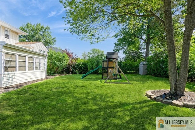 1516 N Indian Pl, North Brunswick, NJ 08902 - view of grassy yard with a playground