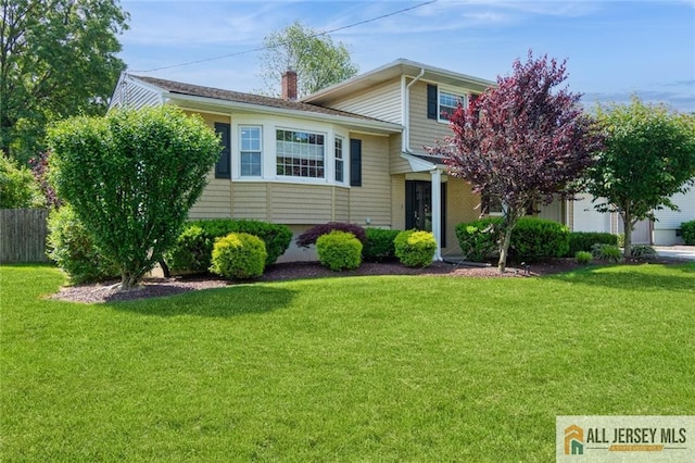 1516 N Indian Pl, North Brunswick, NJ 08902 - split level home featuring a chimney