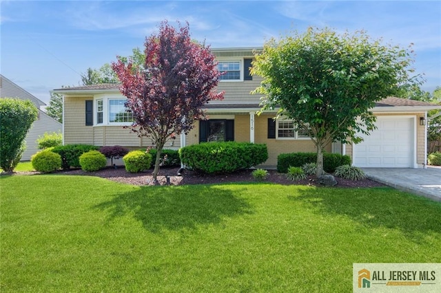 1516 N Indian Pl, North Brunswick, NJ 08902 - view of property hidden behind natural elements featuring a front lawn, a garage, and concrete driveway