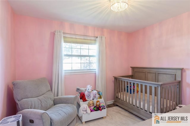 1516 N Indian Pl, North Brunswick, NJ 08902 - bedroom featuring a chandelier and baseboards