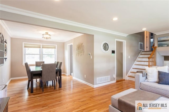 1516 N Indian Pl, North Brunswick, NJ 08902 - dining space featuring stairs, crown molding, light wood-style floors, and recessed lighting